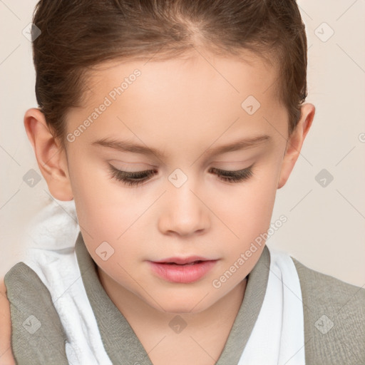 Joyful white child female with short  brown hair and brown eyes