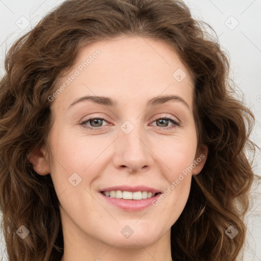 Joyful white young-adult female with long  brown hair and green eyes