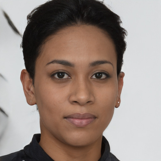 Joyful latino young-adult female with short  brown hair and brown eyes