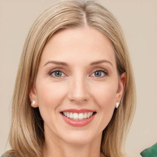 Joyful white young-adult female with long  brown hair and green eyes