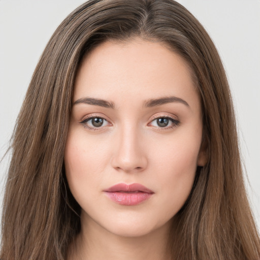 Neutral white young-adult female with long  brown hair and brown eyes