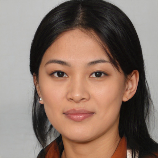 Joyful asian young-adult female with medium  black hair and brown eyes