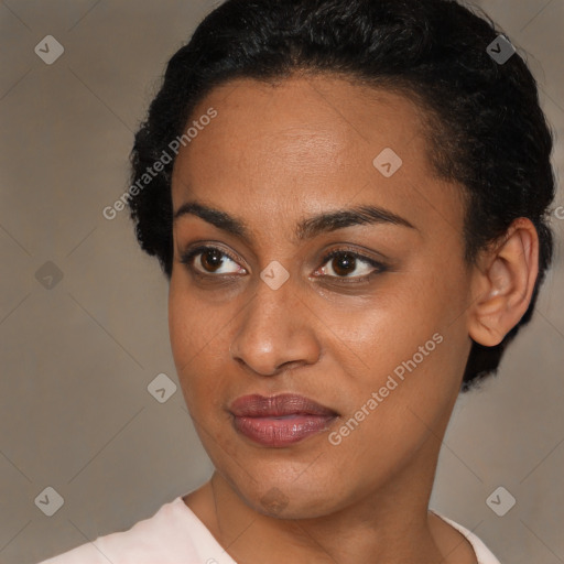 Joyful black young-adult female with short  brown hair and brown eyes