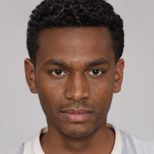 Neutral black young-adult male with short  brown hair and brown eyes