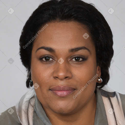 Joyful black adult female with medium  brown hair and brown eyes