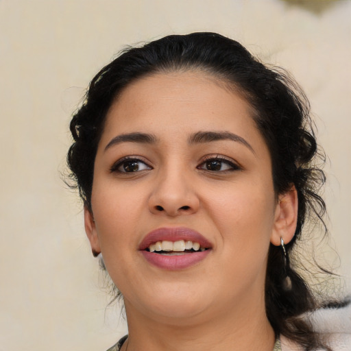 Joyful latino young-adult female with medium  black hair and brown eyes