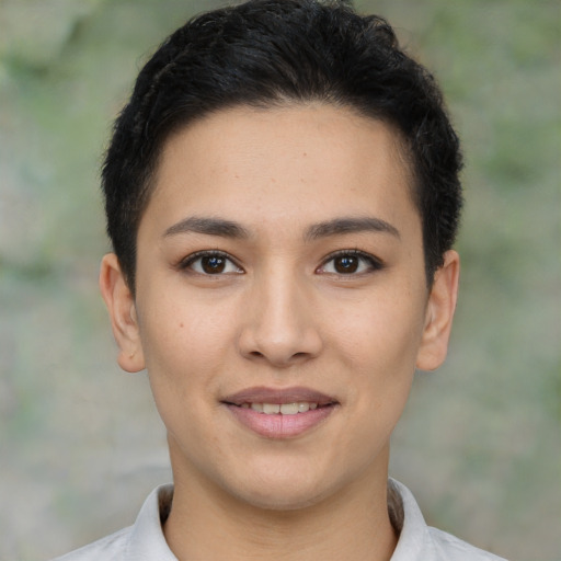 Joyful latino young-adult female with short  brown hair and brown eyes