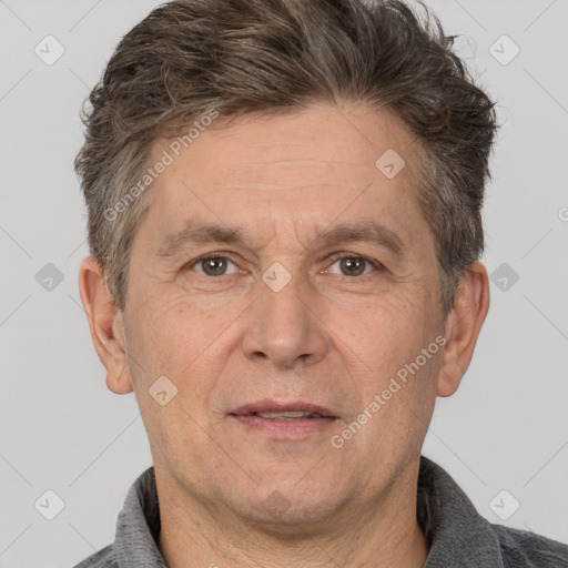 Joyful white middle-aged male with short  brown hair and brown eyes