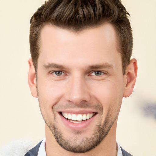 Joyful white young-adult male with short  brown hair and brown eyes