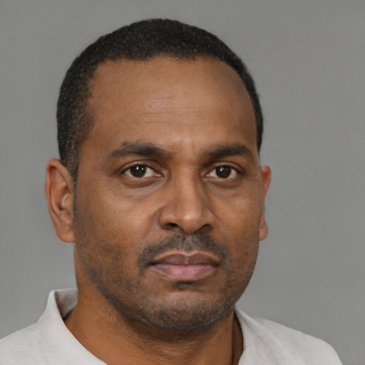Neutral black adult male with short  brown hair and brown eyes