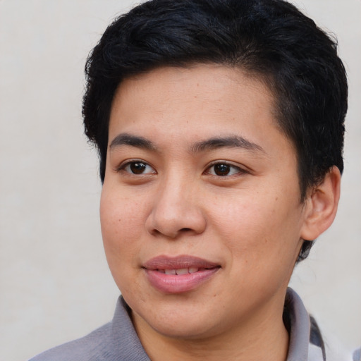 Joyful asian young-adult female with short  brown hair and brown eyes