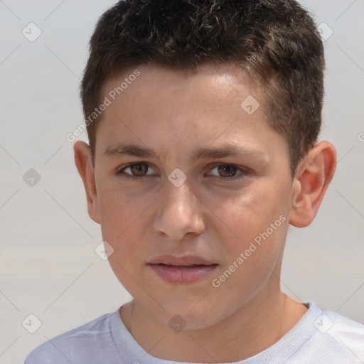 Joyful white child male with short  brown hair and brown eyes