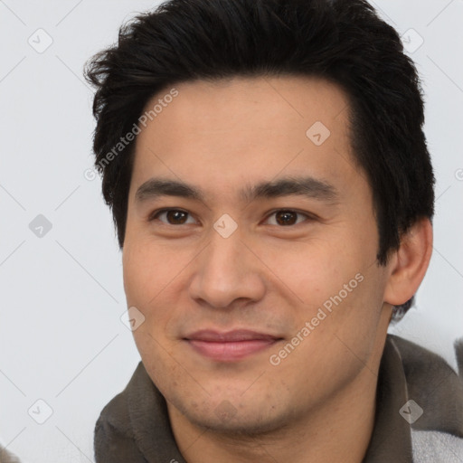 Joyful asian young-adult male with short  black hair and brown eyes