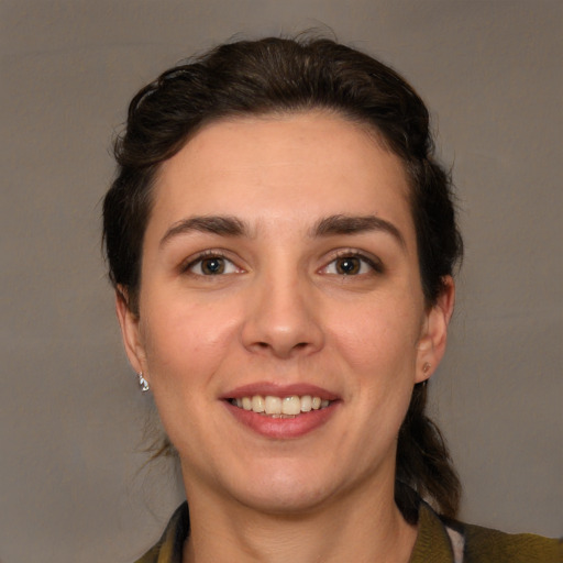 Joyful white young-adult female with medium  brown hair and brown eyes