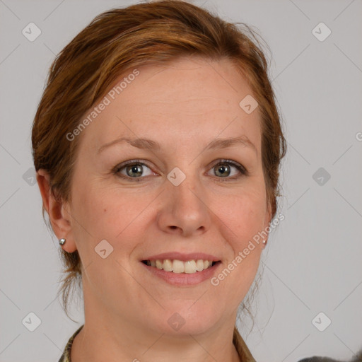 Joyful white adult female with medium  brown hair and grey eyes