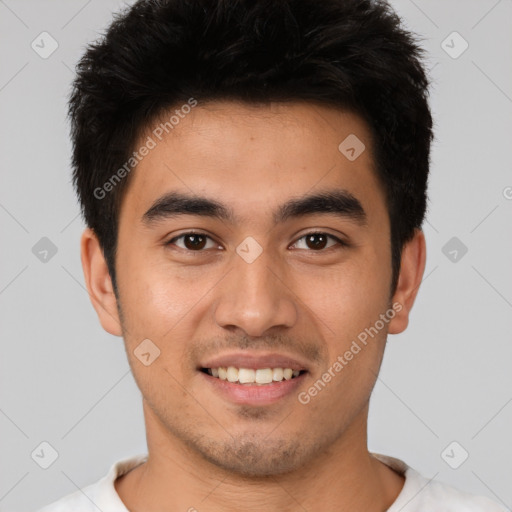 Joyful white young-adult male with short  black hair and brown eyes