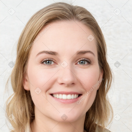 Joyful white young-adult female with medium  brown hair and blue eyes