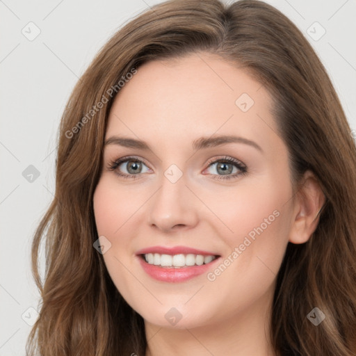 Joyful white young-adult female with long  brown hair and blue eyes