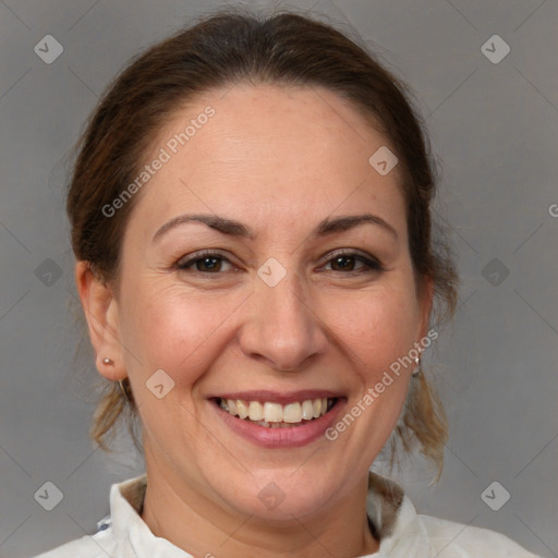 Joyful white adult female with medium  brown hair and brown eyes