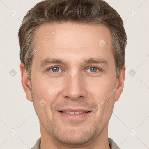 Joyful white adult male with short  brown hair and grey eyes