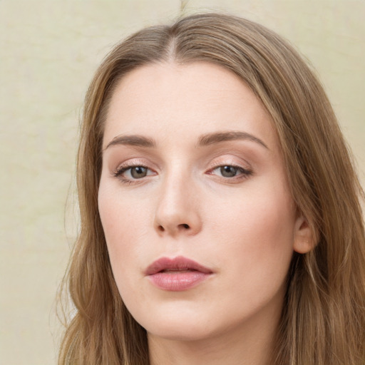 Neutral white young-adult female with long  brown hair and green eyes