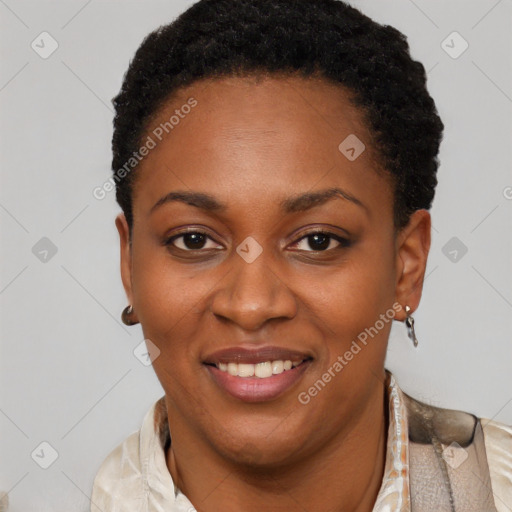 Joyful black young-adult female with short  black hair and brown eyes