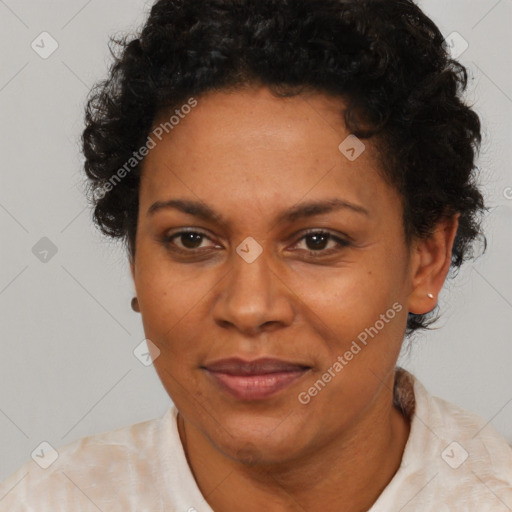 Joyful black adult female with short  brown hair and brown eyes