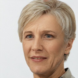 Joyful white adult female with short  blond hair and brown eyes