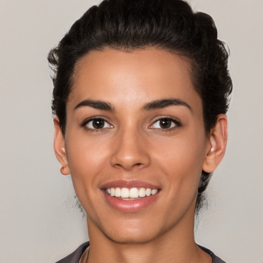 Joyful white young-adult female with short  brown hair and brown eyes