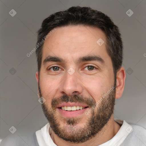 Joyful white young-adult male with short  black hair and brown eyes