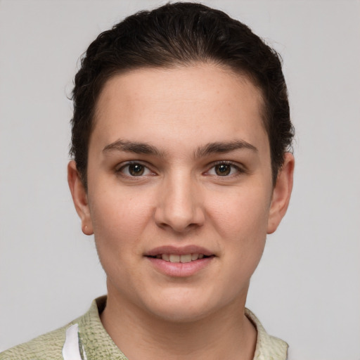 Joyful white young-adult female with short  brown hair and brown eyes