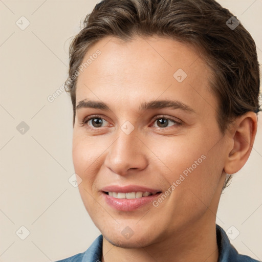 Joyful white young-adult female with short  brown hair and brown eyes