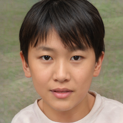 Joyful asian child female with short  brown hair and brown eyes