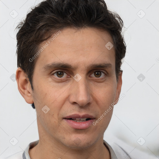 Joyful white adult male with short  brown hair and brown eyes