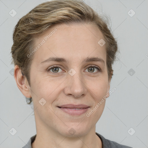 Joyful white adult female with short  brown hair and grey eyes