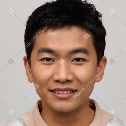 Joyful asian young-adult male with short  black hair and brown eyes