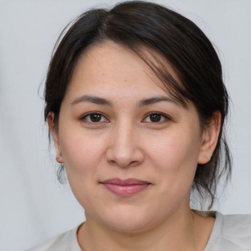 Joyful white young-adult female with medium  brown hair and brown eyes