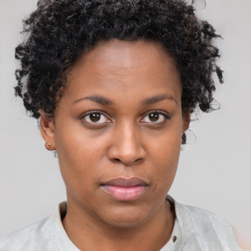 Neutral black young-adult female with short  brown hair and brown eyes