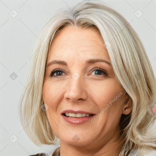 Joyful white adult female with medium  brown hair and blue eyes