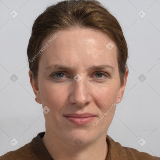 Joyful white adult female with short  brown hair and grey eyes