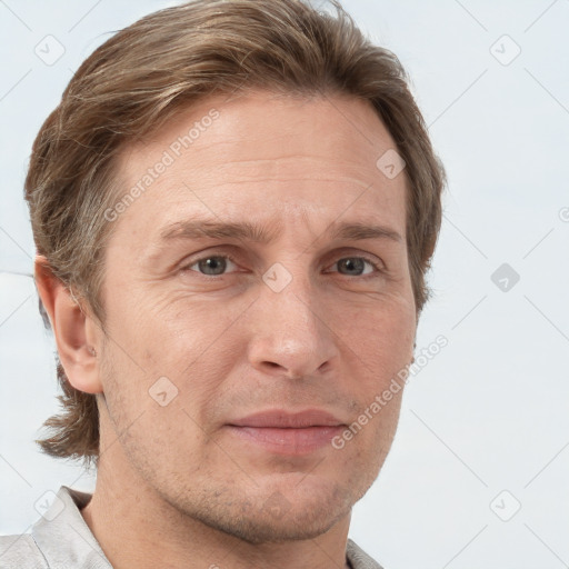 Joyful white adult male with short  brown hair and grey eyes