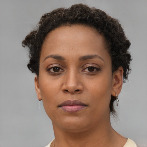 Neutral black young-adult female with short  brown hair and brown eyes