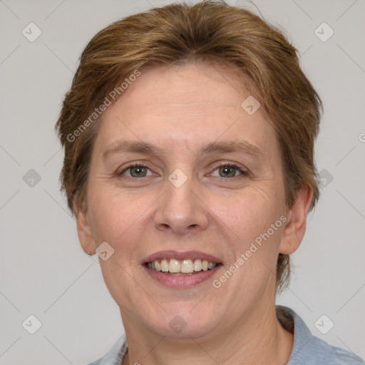 Joyful white adult female with short  brown hair and grey eyes