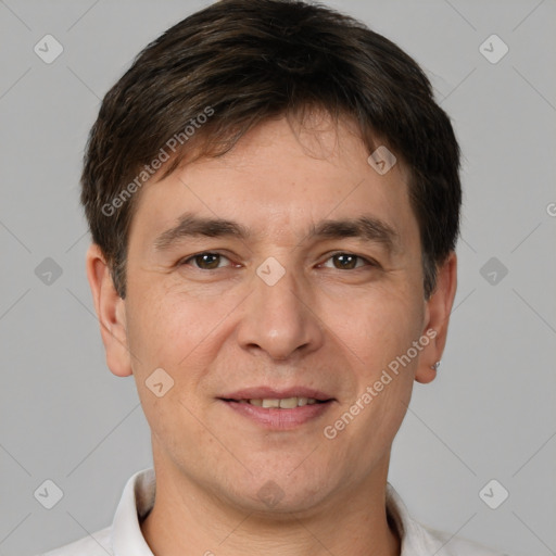 Joyful white adult male with short  brown hair and brown eyes