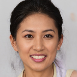 Joyful white young-adult female with medium  brown hair and brown eyes