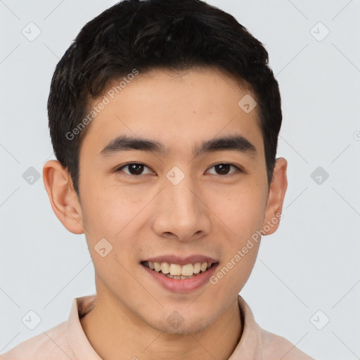 Joyful asian young-adult male with short  brown hair and brown eyes