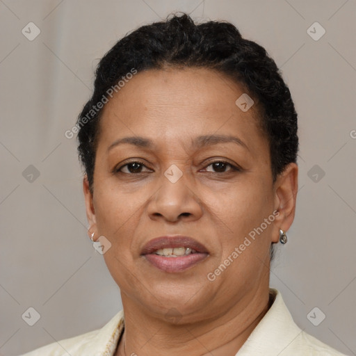 Joyful black adult female with short  brown hair and brown eyes