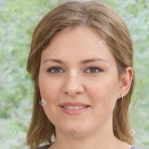 Joyful white young-adult female with medium  brown hair and green eyes