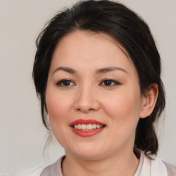 Joyful white young-adult female with medium  brown hair and brown eyes