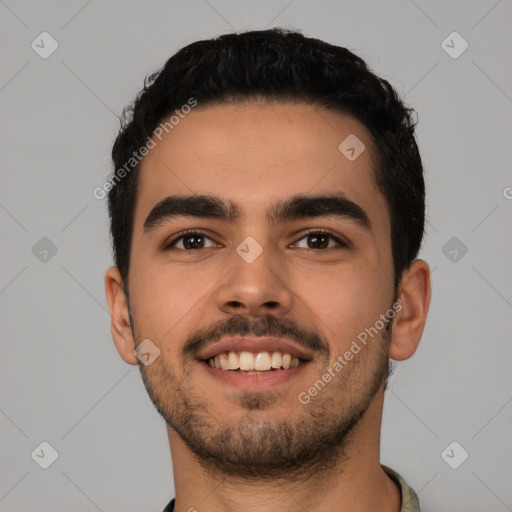 Joyful latino young-adult male with short  black hair and brown eyes